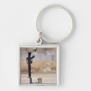Boots, rifle, dog tags, and protective helmet key ring