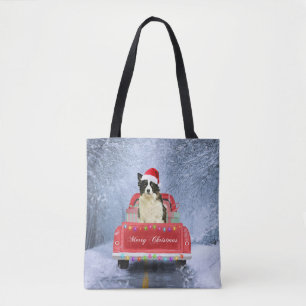 Border Collie Dog in Snow sitting in Christmas Tote Bag