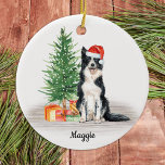 Border Collie Santa Dog Personalised Christmas Ceramic Ornament<br><div class="desc">Decorate your tree or give a special gift this holiday season with this border collie santa dog christmas ornament, and matching decor. This border collie christmas ornament features a watercolor dog in a santa hat and tree. Personalise with name front, year back. This border collie christmas ornament will be a...</div>