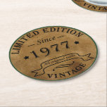 Born in 1977 vintage birthday round paper coaster<br><div class="desc">You can add some originality to your wardrobe collection with this vintage retro rustic graphic design with awesome typography font lettering, a great gift for men, women, husbands, wives, girlfriend, and a boyfriend who will love this one-of-a-kind artwork. The best and most fun holiday present for your happy birthday party....</div>