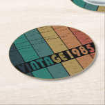 born in 1985 vintage 40th birthday gift round paper coaster<br><div class="desc">This vintage classic graphic design with awesome typography font lettering can add originality to your wardrobe collection. It is a great gift idea for men, women, husbands, wives, girlfriends, and boyfriends who will love this one-of-a-kind artwork. It is the best and most funny holiday present for your happy birthday party....</div>