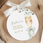 Botanical Champagne Bridal Shower Favor Tags<br><div class="desc">Celebrate the bride-to-be with these elegant favor tags, featuring a delicate watercolor champagne flute adorned with a soft sage green bow and lush eucalyptus greenery. The design elegantly incorporates the event details and a personalized name, making it a perfect addition to bridal shower favors. These tags add a sophisticated and...</div>