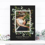 Botanical Greenery Married and Merry Photo Holiday Card<br><div class="desc">This Christmas | Holiday photo card features painted watercolor eucalyptus,  green leaves,  red berries,  pine branches,  and a faux gold rectangle frame with a black background. For more advanced customisation of this design,  please click the "Customise further" link. Matching items are also available.</div>