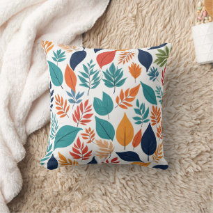 Botanical pattern with tropical leaves on white cushion