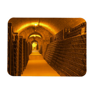 Bottles aging either in pupitres (racks) waiting magnet