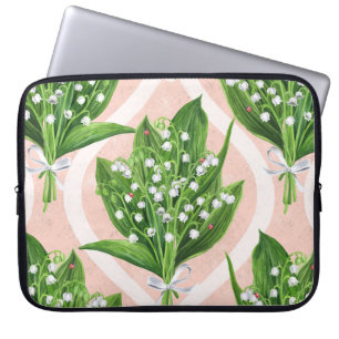 Bouquet of lilly of the valley flowers on green laptop sleeve