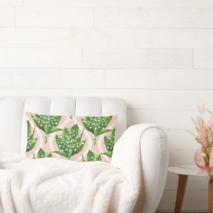 Bouquet of lilly of the valley flowers on green lumbar cushion