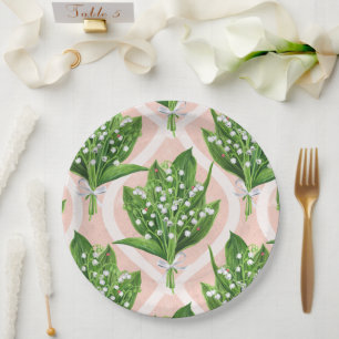 Bouquet of lilly of the valley flowers on green paper plate