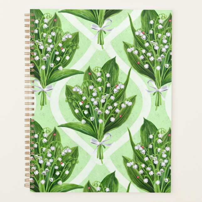 Bouquet of lilly of the valley flowers on green planner (Front)