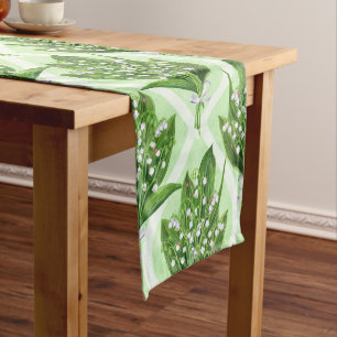 Bouquet of lilly of the valley flowers on green short table runner