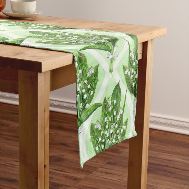 Bouquet of lilly of the valley flowers on green short table runner (In Situ)