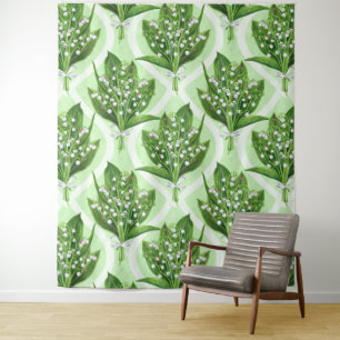 Bouquet of lilly of the valley flowers on green tapestry