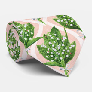 Bouquet of lilly of the valley flowers on green tie