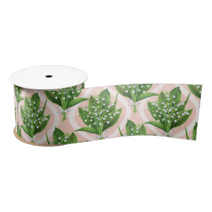 Bouquet of lilly of the valley flowers on pink satin ribbon