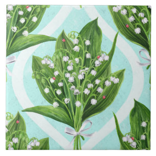 Bouquet of lily of the valley flowers on blue ceramic tile