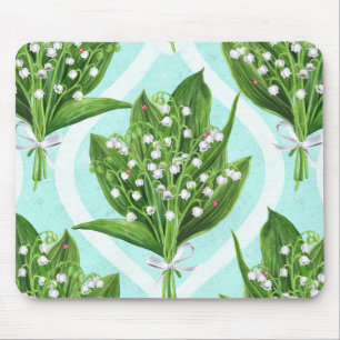 Bouquet of lily of the valley flowers on blue mouse pad