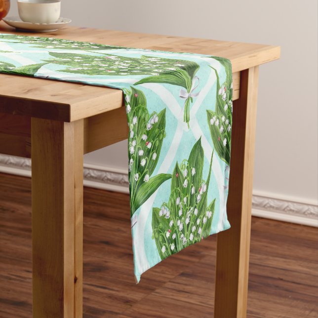 Bouquet of lily of the valley flowers on blue short table runner (In Situ)