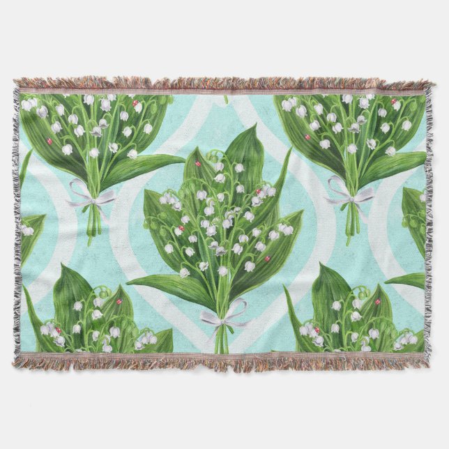 Bouquet of lily of the valley flowers on blue throw blanket (Front)