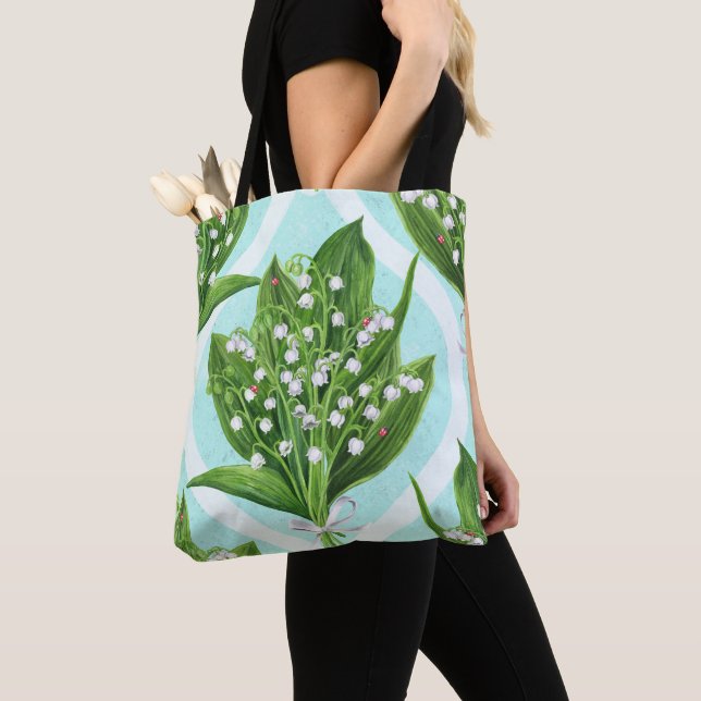 Bouquet of lily of the valley flowers on blue tote bag (Close Up)