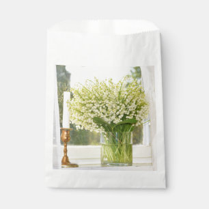 Bouquet of spring flowers lilies of the valley favour bag