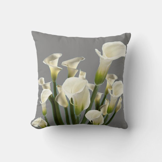 BOUQUET OF WHITE CALLA LILIES ON GREY CUSHION (Front)