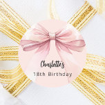 Bow pink Birthday Classic Round Sticker<br><div class="desc">A blush pink coloured background. Decorated with a large bow.  Personalise and add a name. Black handwritten style script.</div>