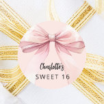 Bow pink Sweet 16 Classic Round Sticker<br><div class="desc">A blush pink coloured background. Decorated with a large bow.  Personalise and add a name. Black handwritten style script.</div>