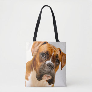 Boxer puppy on ivory cream backdrop. tote bag