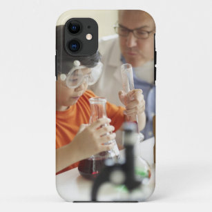 Boy (6-7) and teacher in chemistry class iPhone 11 case