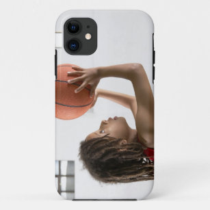 Boy aiming a shot with a basketball in a school iPhone 11 case