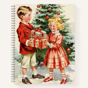 Boy and girl giving each other Christmas presents Notebook