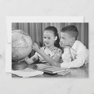 Boy and Girl Viewing Globe