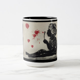 Boy blowing heart bubbles Two-Tone coffee mug
