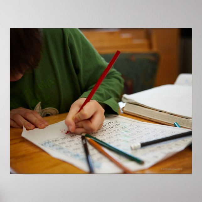 Boy concentrating on math homework poster (Front)