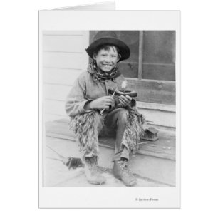 Boy Dressed as Cowboy with Toys