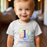 Boy First Birthday with Name and Balloons Baby T-Shirt<br><div class="desc">Celebrate your son's first birthday with this sweet first birthday shirt that features his name and birthday age over watercolor pastel balloons. MATCHING items in our collection.</div>
