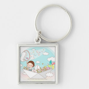 Boy sitting in paper boat key ring