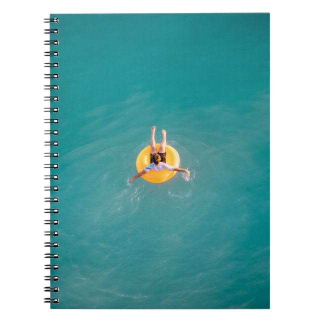 Boy sitting on buoy notebook (Front)