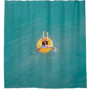 Boy sitting on buoy shower curtain