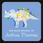 Boys Blue This Book Belongs Dinosaur and Name Kids Square Sticker<br><div class="desc">This beautiful boy's 'this book belongs' bookplate design features a watercolor blue and gold dinosaur,  and has place for you to add your kids name in lovely typography. Perfect for your child's back to school supplies. Check out the rest of our collection for other cute kids items.</div>