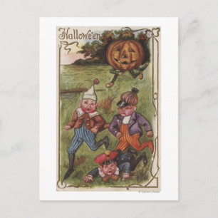 Boys Running From Pumpkin Man in Field Postcard