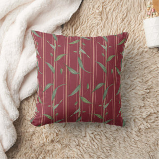 Branch of leaves on red wallpaper cushion