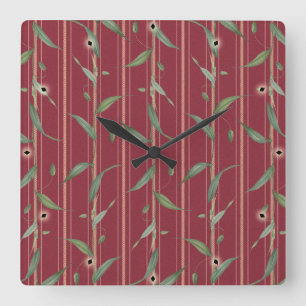 Branch of leaves on red wallpaper square wall clock