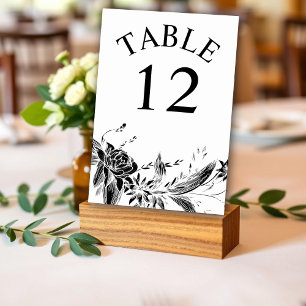 Branch with bllack and white flowers wedding table number