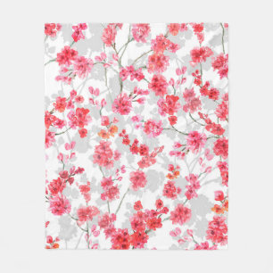 Branches of cherry blossoms on white and grey back fleece blanket