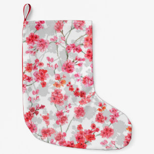 Branches of cherry blossoms on white and grey back small christmas stocking