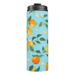 Branches of oranges with flowers on a blue backgro thermal tumbler