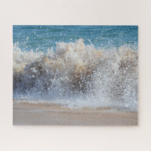 Breaking wave crashing onto sandy beach jigsaw puzzle