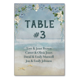 Bridal Floral Arch On Ocean Table Number