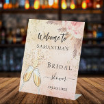 Bridal Shower bubbly brunch rose florals welcome Pedestal Sign<br><div class="desc">For a Bridal Shower.  A rose gold and pink rustic gradient background,  pink flowers and pampas grass. Bubbles and a pair of flutes.    Personalise and add a name.</div>